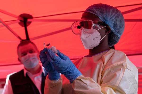 A nurse prepares a dose during an Ebola trial vaccination campaign in Kampala, Uganda. Photo: AFP