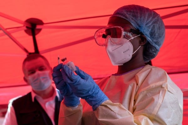 A nurse prepares a dose during an Ebola trial vaccination campaign in Kampala, Uganda. Photo: AFP A nurse prepares a dose during an Ebola trial vaccination campaign in Kampala, Uganda. Photo: AFP