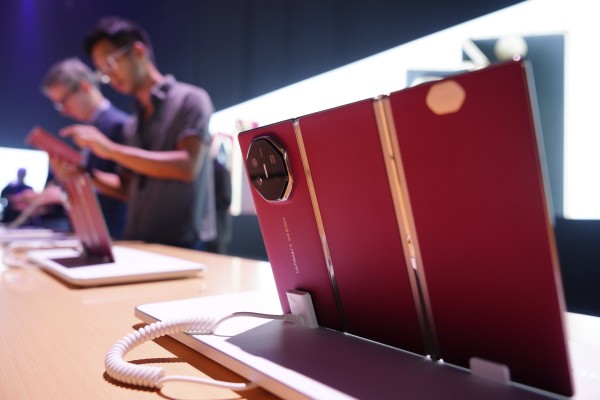 Visitors check out the Mate XT trifold smartphone on the sidelines of Huawei Technologies’ global roll-out of the handset in Kuala Lumpur, Malaysia, on Tuesday. Photo: AP