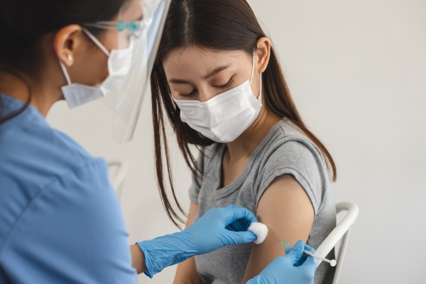 A person receives a vaccination. WHO member states agreed on a landmark pandemic agreement to prevent future crises, addressing equity and tech transfer. Photo: Shutterstock