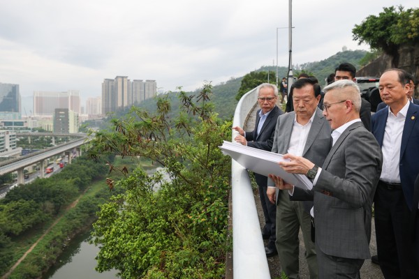 Hong Kong and Macau Affairs Office Director Xia Baolong (second left) and city leader Sam Hou-fai (left) inspect a site earmarked for development. Photo: Handout