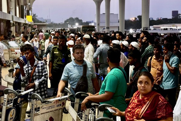 Prospective migrants and their families gather outside Dhaka airport on May 31 last year. Photo: Redwan Ahmed