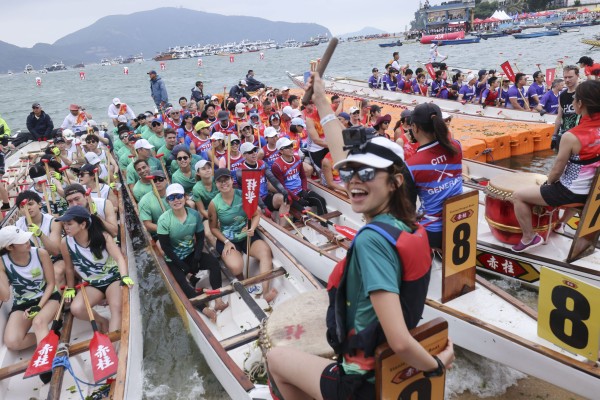 Dragon boat paddlers race in Stanley. Photo: Nora Tam