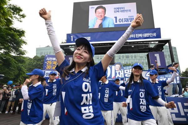 Supporters of South Korean presidential candidate Lee Jae-myung dance during an election campaign event on Wednesday. Photo: AFP