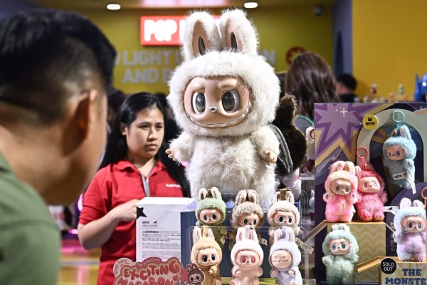 People look at Labubu products at a Pop Mart pop-up store in Siam Center shopping mall, in Bangkok, Thailand, on May 6. Photo: AFP