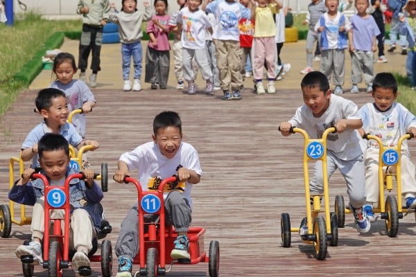 Children compete in a bicycle race at the Second Experimental Kindergarten in Yantai High-tech Zone, in east China’s Shandong province, in May last year. Photo: CFOTO/Future Publishing via Getty Images Children compete in a bicycle race at the Second Experimental Kindergarten in Yantai High-tech Zone, in east China’s Shandong province, in May last year. Photo: CFOTO/Future Publishing via Getty Images