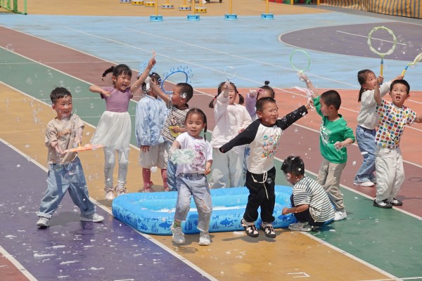 Children play with bubbles at the Second Experimental Kindergarten in the Yantai High-tech Zone, in eastern China’s Shandong province, in May last year. Photo: Getty Images