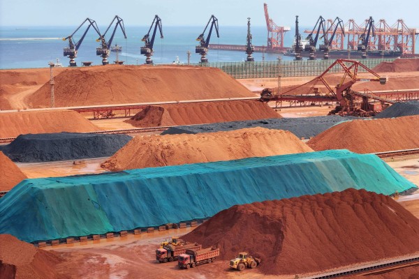 Piles of imported iron ore, bauxite and coal are stored at a port in China’s eastern Shandong province. Fortescue is a major supplier of iron ore to China. Photo: AFP Piles of imported iron ore, bauxite and coal are stored at a port in China’s eastern Shandong province. Fortescue is a major supplier of iron ore to China. Photo: AFP
