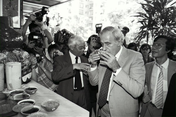 Former Hong Kong governor David Wilson tries a bowl of Chinese herbal tea during his visit to Mei Foo Sun Chuen. Photo: SCMP Archives Former Hong Kong governor David Wilson tries a bowl of Chinese herbal tea during his visit to Mei Foo Sun Chuen. Photo: SCMP Archives
