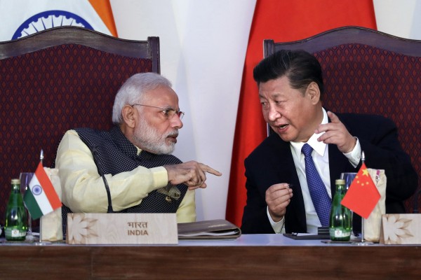 Indian Prime Minister Narendra Modi talks to Chinese President Xi Jinping during a Brics summit in Goa in 2016. Photo: AP