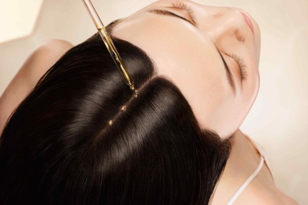 Slow down and apply products such as Guerlain’s Abeille Royale Scalp and Hair Youth-Oil-in Serum – your hair will thank you later. Photo: Handout