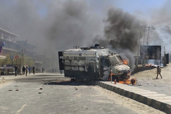A police vehicle is set on fire during a protest by locals demanding federal statehood from the Indian government in the region of Ladakh on Wednesday. Photo: AP A police vehicle is set on fire during a protest by locals demanding federal statehood from the Indian government in the region of Ladakh on Wednesday. Photo: AP