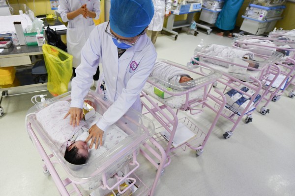 A newborn baby is cared for in a Chinese hospital’s neonatal care centre. Photo: SOPA Images