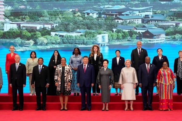 President Xi Jinping and his wife Peng Liyuan pose with national leaders and other delegates ahead of the opening ceremony for the Global Women’s Summit, in Beijing on Monday. Photo: Pool via Reuters President Xi Jinping and his wife Peng Liyuan pose with national leaders and other delegates ahead of the opening ceremony for the Global Women’s Summit, in Beijing on Monday. Photo: Pool via Reuters