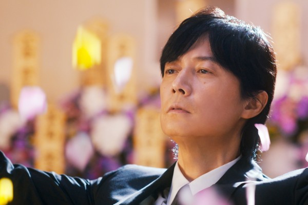 Masaharu Fukuyama in a still from Black Showman (category: IIA, Japanese), co-starring Kasumi Arimura and directed by Ryo Tanaka.