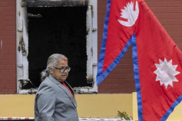 Nepalese Prime Minister Sushila Karki looks on during the swearing-in ceremony of new ministers in front of the President’s Office, which had been set on fire by protesters during the protests last month, in Kathmandu, Nepal, on September 15. Photo: EPA Nepalese Prime Minister Sushila Karki looks on during the swearing-in ceremony of new ministers in front of the President’s Office, which had been set on fire by protesters during the protests last month, in Kathmandu, Nepal, on September 15. Photo: EPA