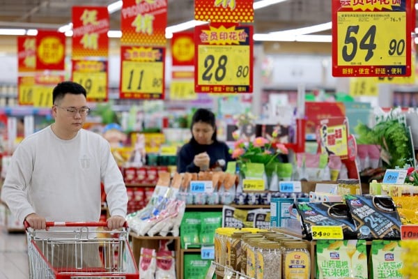 People shop at a supermarket in Zaozhuang, Shandong province, last month. Photo: Xinhua People shop at a supermarket in Zaozhuang, Shandong province, last month. Photo: Xinhua