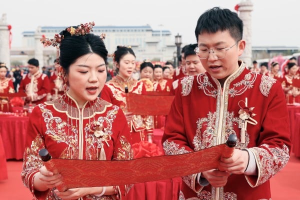 Couples take part in a mass wedding ceremony in China’s central Anhui province. Photo: Xinhua Couples take part in a mass wedding ceremony in China’s central Anhui province. Photo: Xinhua