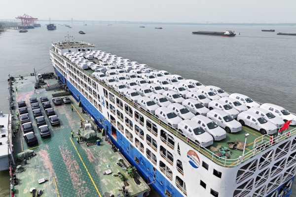 Vehicles are seen loaded on a cargo ship for export at Wuhu Port, Anhui province. Photo: Getty Images