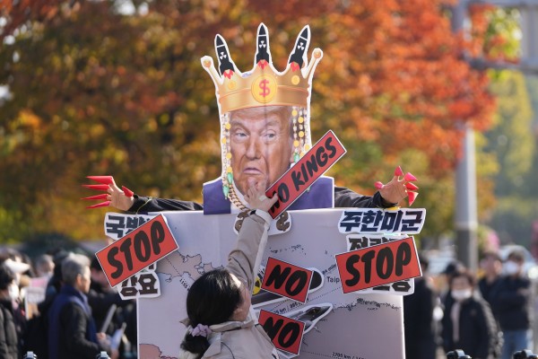 A sign is stuck onto a picture of US President Donald Trump near the Defence Ministry in Seoul on November 4, as protesters demand that the United States not help South Korea acquire nuclear-powered submarines. Photo: AP A sign is stuck onto a picture of US President Donald Trump near the Defence Ministry in Seoul on November 4, as protesters demand that the United States not help South Korea acquire nuclear-powered submarines. Photo: AP
