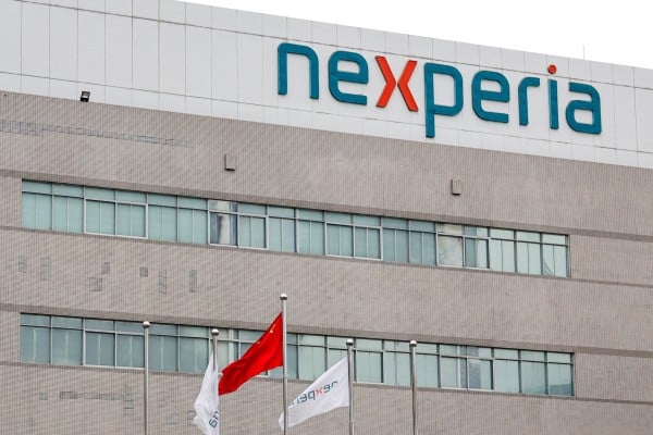 Flags fly next to a logo of Nexperia at the facade of its factory in Guangdong province amid a chip-supply shortage caused by a diplomatic standoff between China and the Netherlands over the company. Photo: Reuters Flags fly next to a logo of Nexperia at the facade of its factory in Guangdong province amid a chip-supply shortage caused by a diplomatic standoff between China and the Netherlands over the company. Photo: Reuters