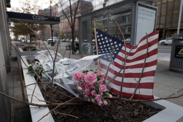 A makeshift memorial in Washington a day after two National Guard members were shot. Photo: Reuters A makeshift memorial in Washington a day after two National Guard members were shot. Photo: Reuters