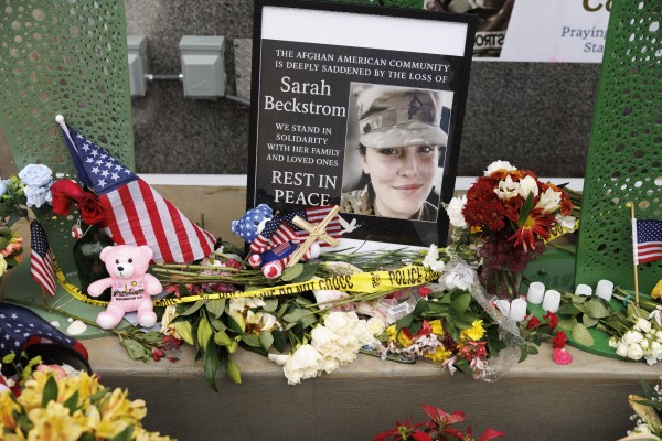 Tributes are seen on Tuesday at the scene where two National Guard members were shot in Washington. Photo: EPA