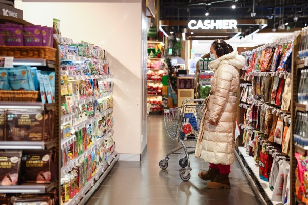 A woman shops in a supermarket in Beijing on December 8, 2025. Photo: EPA A woman shops in a supermarket in Beijing on December 8, 2025. Photo: EPA