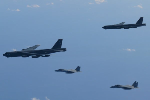 Japanese F-15 fighters and US B-52 bombers over the Sea of Japan. Photo: Defense Ministry of Japan via Reuters Japanese F-15 fighters and US B-52 bombers over the Sea of Japan. Photo: Defense Ministry of Japan via Reuters
