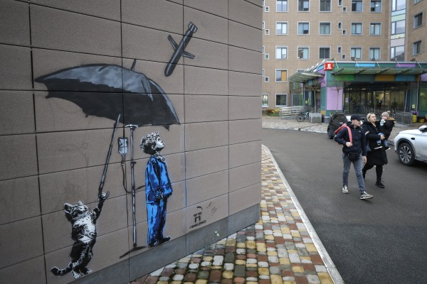A cat protects a boy from a Russian missile with an umbrella, in a mural by Ukrainian artist Andriy Yarmolenko, seen by on Wednesday at a children’s hospital in Kyiv. Photo: EPA