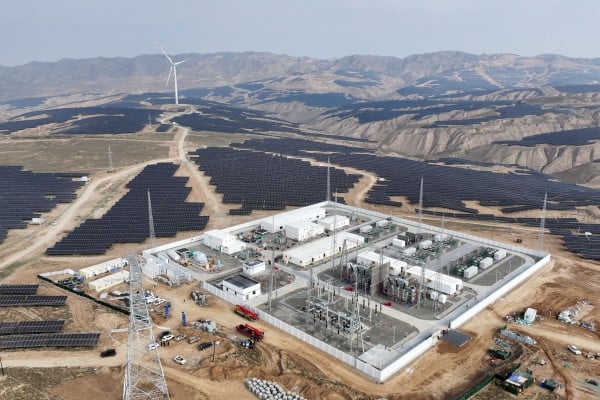 An aerial  view of the No 1 booster station of the Ningxia Power Investment Yongli (Zhongwei) 3-megawatt photovoltaic green power project, in Shapotou district, Zhongwei city, Ningxia. It was officially connected to the grid and began power generation on October 25. Photo : Xinhua