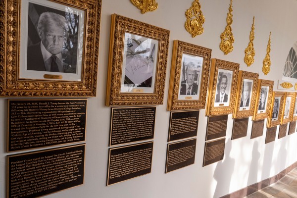 New plaques have been placed underneath presidential portraits on the Colonnade at the White House. Photo: AP