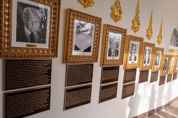 New plaques have been placed underneath presidential portraits on the Colonnade at the White House. Photo: AP New plaques have been placed underneath presidential portraits on the Colonnade at the White House. Photo: AP