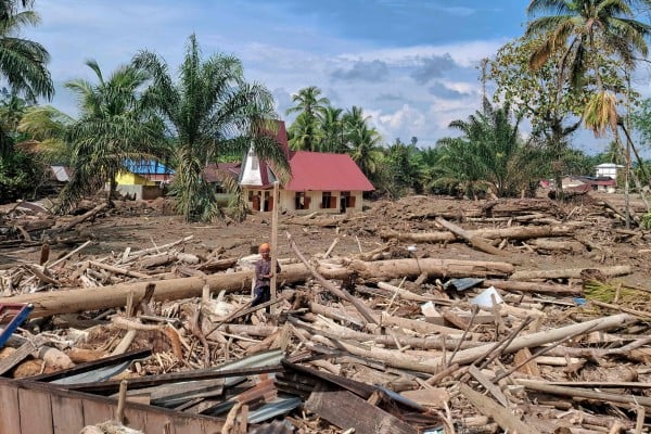 The Angkola Protestant Church stands amid flood devastation at Aek Ngadol village in South Tapanuli, North Sumatra province, Indonesia on December 25. Photo: AFP The Angkola Protestant Church stands amid flood devastation at Aek Ngadol village in South Tapanuli, North Sumatra province, Indonesia on December 25. Photo: AFP