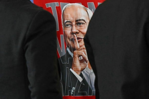 A supporter’s T-shirt bears an image of Najib Razak during his 1MDB trial in Putrajaya, Malaysia, on Friday. Photo: AFP