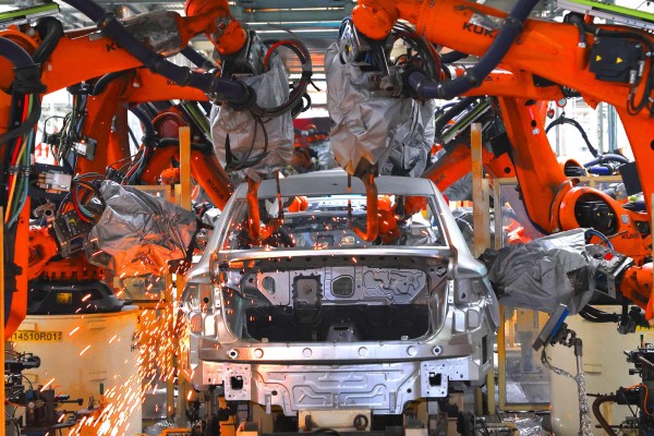 Robots carry out welding operations at the FAW-Volkswagen production based in Jimo district, Qingdao, eastern China’s Shandong province, on February 19. Photo: AFP