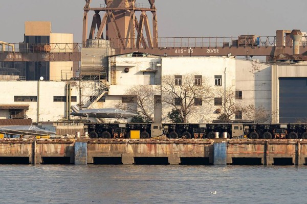 Three trucks linked to form what appears to be a launch track for large drones have been spotted at a dock in China. Photo: Handout Three trucks linked to form what appears to be a launch track for large drones have been spotted at a dock in China. Photo: Handout