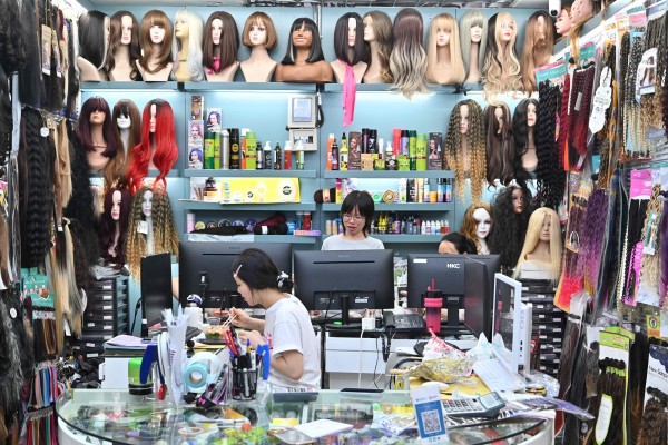 Vendors work at the Yiwu International Trade Market, a vast emporium for wholesale goods often dubbed the “world’s supermarket”, in Yiwu, Zhejiang province. The city has recorded strong growth in exports this year despite the US-China trade war. Photo: AFP