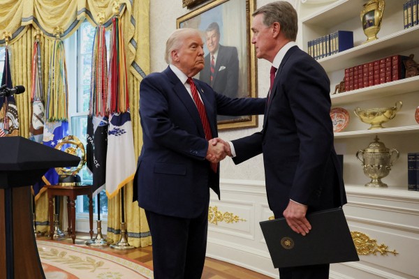 US President Donald Trump shakes hands with David Perdue during Perdue’s swearing-in ceremony as the US Ambassador to China at the White House in May. The pair are set to meet at Trump’s Mar-a-Lago estate in Florida on Friday. Photo: Reuters
