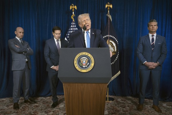 US President Donald Trump, flanked by senior members of his administration, speaks to the press following American military strikes on Caracas, Venezuela. Photo: TNS