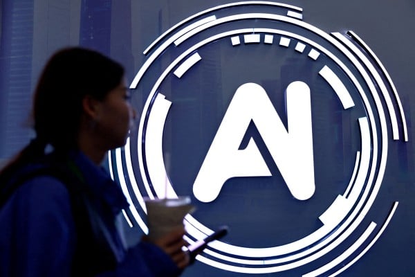 A woman walks past a sign reading “AI” at the World Internet Conference in Wuzhen, Zhejiang province, in November. Photo: Reuters A woman walks past a sign reading “AI” at the World Internet Conference in Wuzhen, Zhejiang province, in November. Photo: Reuters
