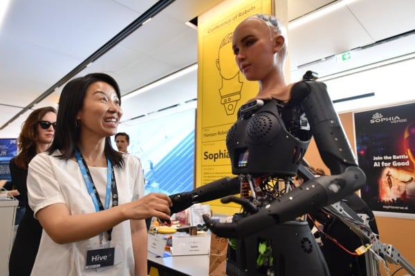 A participant interacts with a robot at the AI for Good Global Summit in Geneva, Switzerland, on July 7, 2023. Photo: Xinhua A participant interacts with a robot at the AI for Good Global Summit in Geneva, Switzerland, on July 7, 2023. Photo: Xinhua