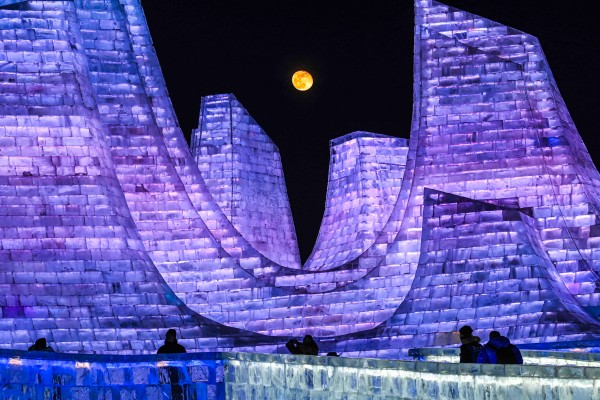 The moon rises above illuminated ice sculptures during the opening ceremony of the 42nd Harbin China International Ice and Snow Festival at Harbin in northeastern China’s Heilongjiang province on January 5. Photo: AFP