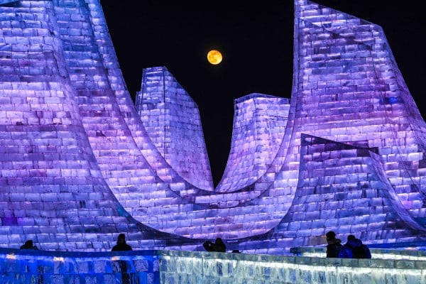 The moon rises above illuminated ice sculptures during the opening ceremony of the 42nd Harbin China International Ice and Snow Festival at Harbin in northeastern China’s Heilongjiang province on January 5. Photo: AFP The moon rises above illuminated ice sculptures during the opening ceremony of the 42nd Harbin China International Ice and Snow Festival at Harbin in northeastern China’s Heilongjiang province on January 5. Photo: AFP