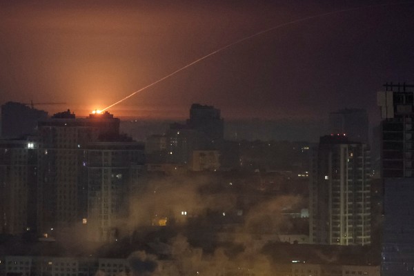 Ukrainian servicemen shoot down a missile during a Russian strike in Kyiv on Tuesday. Photo: Reuters