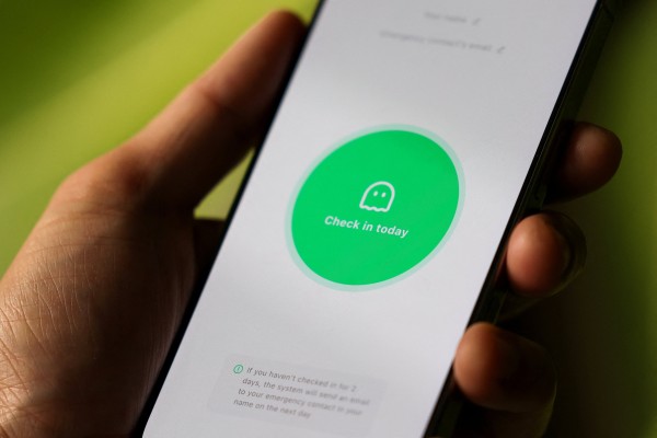 A user checks in using the viral app Are You Dead?, also known as Demumu in English, which surged to the top of the paid app chart on Apple’s AppStore in China last week. Photo: Reuters