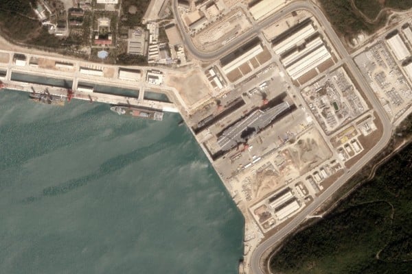 Analysis by a US geospatial intelligence company says satellite imagery shows the first use by a Chinese aircraft carrier of a new dry dock near the South China Sea. Photo: AllSource Analysis Analysis by a US geospatial intelligence company says satellite imagery shows the first use by a Chinese aircraft carrier of a new dry dock near the South China Sea. Photo: AllSource Analysis