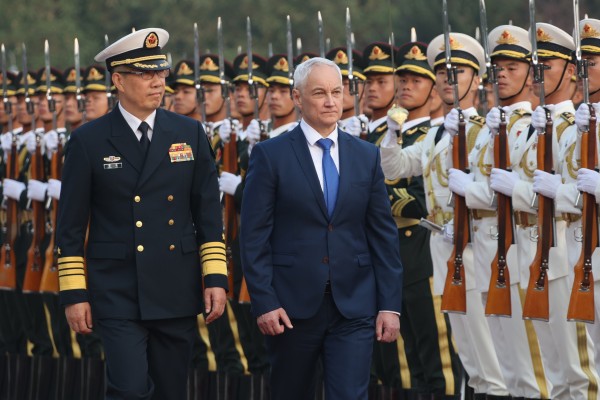 Chinese Defence Minister Dong Jun and his Russian counterpart Andrei Belousov inspect an honour guard during a welcoming ceremony in Beijing in October 2024. Photo: EPA-EFE 
