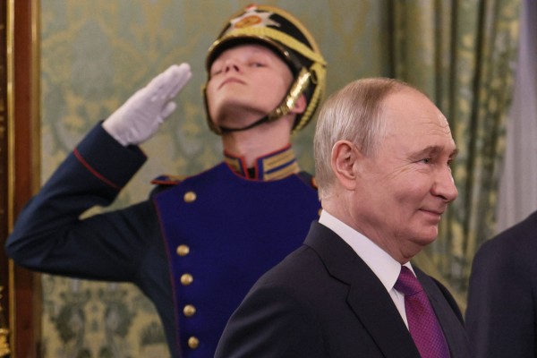 Russian President Vladimir Putin enters a hall for the meeting with Syria’s president at the Kremlin in Moscow. Photo: Kremlin pool via AFP