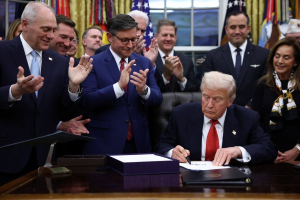US President Donald Trump signs the funding bill to end the US government shutdown in November. Photo: Reuters